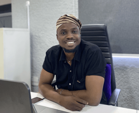 Engineer at his desk smiling for the camera